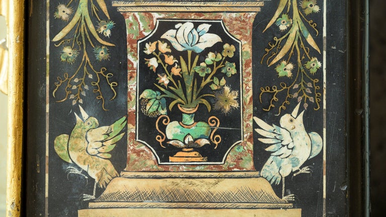 Detail of a chimneypiece with two birds and flowers in the Queen's Closet at Ham House and Garden, London
